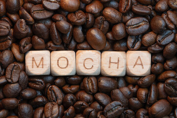 Mocha coffee beans and wooden letter blocks display