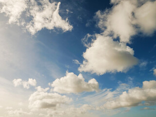 Obraz premium Blue cloudy sky, nature background for design. Clouds have random shape and form.