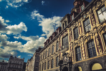 Fototapeta premium Warm evening light on old stock exchange facade, Lille city, Hauts de France.