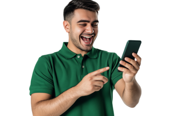 Young man in a green polo shirt joyfully interacting with his smartphone, showcasing excitement in a bright, cheerful environment, possibly in a home or casual setting