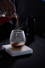 pouring coffee into a glass