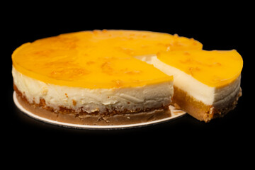 Orange cheesecake isolated on a white background.
