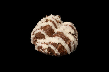 Profiteroles with coconut cream on a black background.