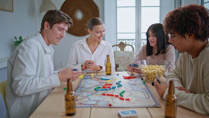 Multiethnic friends having home party on weekends closeup. Happy buddies playing