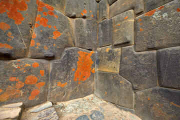 Majestic view of the Ollantaytambo archaeological site in Cusco, Peru. Massive stone terraces rise against the Andean mountains, showcasing the architectural mastery and engineering of the Incas. 