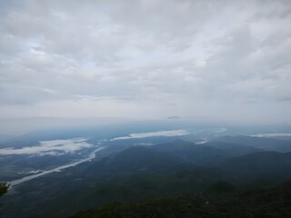 Sea of ​​clouds, forest, river, small city