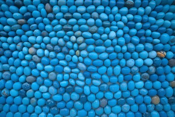 A vibrant arrangement of blue stones creates a captivating texture and color gradient.