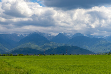 Fototapeta premium Landscape with the Fagaras Mountains in Romania seen from a distance