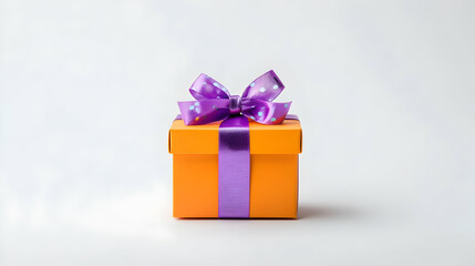 Fototapeta premium Orange gift box with purple ribbon and bow