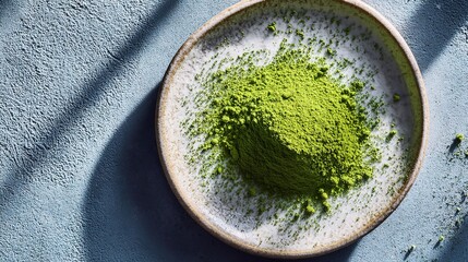Vibrant Green Matcha Powder Displayed on Ceramic Plate Surface