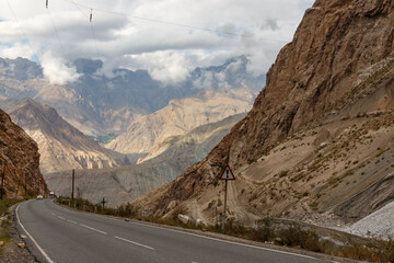 M34 automobile road winds through mountainous landscape in Tajikistan