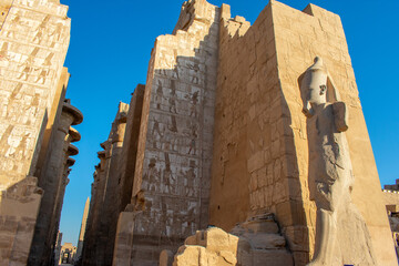 Karnak Temple in Luxor, Egypt. Entrance and Avenue of Sphinxes. Temple complex of Ancient Egypt in honor of the god Amun-Ra