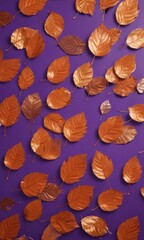 Dried orange metallic leaves, violet backdrop  Geometric leaf arrangement creates striking autumnal pattern , texture, color