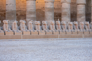 Karnak Temple in Luxor, Egypt. Entrance and Avenue of Sphinxes. Temple complex of Ancient Egypt in honor of the god Amun-Ra