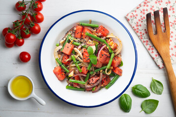 Summer salad with watermelon, fennel and green beans. Top view table with christmas decorations.