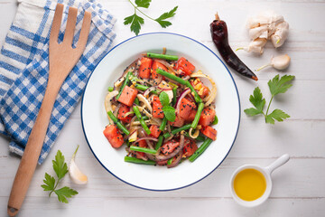 Summer salad with watermelon, fennel and green beans. Top view table with christmas decorations.