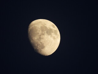 Waxing gibbous moon within the dark nighttime sky. Visible over Kent County, Delaware.