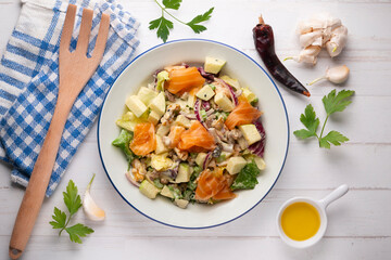 Waldorf salad with delicious smoked salmon, apple, raisins, walnuts, and mayonnaise dressing.