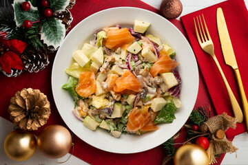 Waldorf salad with delicious smoked salmon, apple, raisins, walnuts, and mayonnaise dressing.