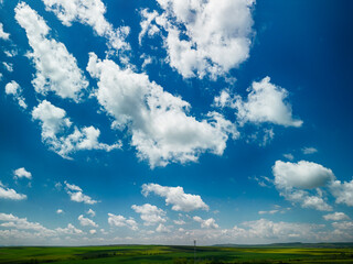 Big white fluffy clouds in the blue sky.Summer background. - Image	
