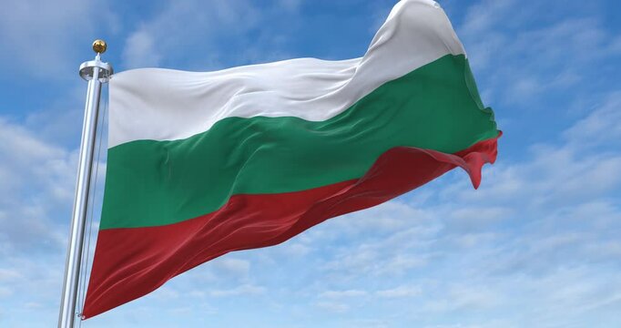 Bulgaria flag with flagpole waving in wind, rolling clouds background looping, 4K video (Perfect Loop)