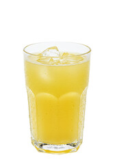 Cold, yellow drink with ice cubes in a clear glass. Refreshing and delicious!