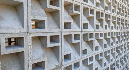 concrete roster wall that functions as air ventilation and decoration