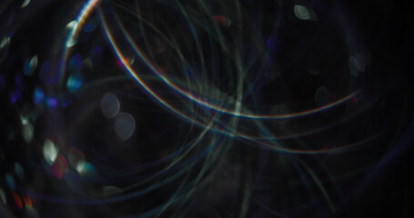 Defocused light flare. Night radiance. Rainbow multicolor illuminated festive blue lens on abstract bokeh blurred background.