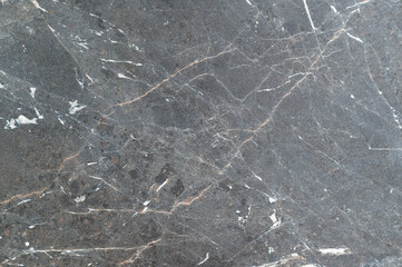 Gray stone surface with natural marble pattern and subtle white and brown veins texture