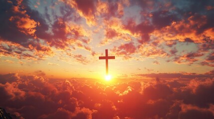 Fototapeta premium A silhouette of a cross against a radiant sunrise in a cloudy sky.