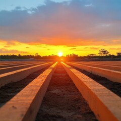 Wooden beams under sunset sky