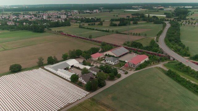 Drone View of a Modern Farm in Europe &ndash; Aerial Footage of Agricultural Buildings and Farmland