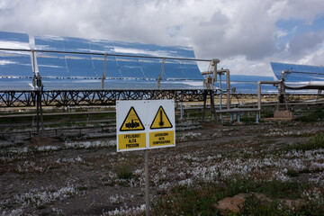 Hazard signs near solar panels