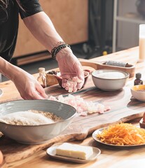 Hands skillfully prepare traditional ingredients for Easter cozonac, highlighting the essence of family recipes. The warm, inviting atmosphere reflects heritage and the joy of home baking