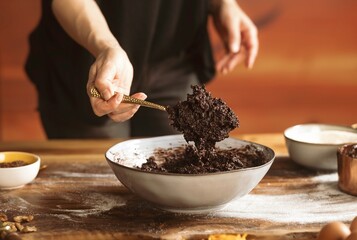 Mixing together an array of traditional baking ingredients for Easter cozonac, this rustic setup reflects a heartfelt connection to family traditions and the joy of homemade treats