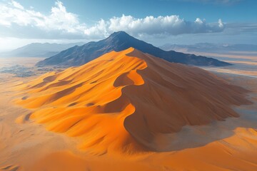 Naklejka premium Majestic sand dunes rise under a bright sky near a mountain in the desert landscape at sunset