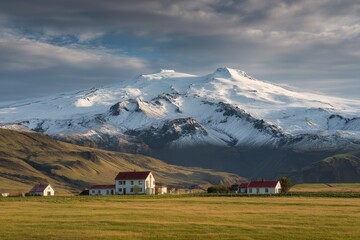 The Infamous Eyjafjallaj&Atilde;&para;kull Volcano Towers Over the Picturesque Thorvaldseyri Village at Dawn