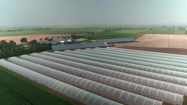 Drone Footage of Greenhouses on a Modern Farm in Europe &ndash; Aerial View of Agricultural Production