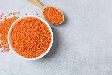 Red lentils on a gray background