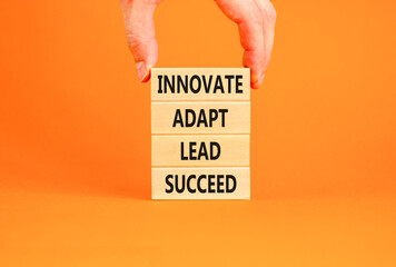 Innovate adapt lead succeed symbol. Concept words Innovate Adapt Lead Succeed on beautiful wooden...