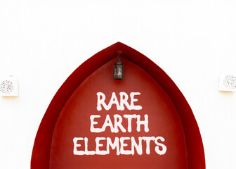 Rare earth elements symbol. Concept words Rare earth elements on beautiful white and red wall....