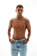 Fototapeta premium Athletic male model showcases his toned physique in a fashion studio, exuding confidence and style. Perfect for fashion campaigns and fitness branding.