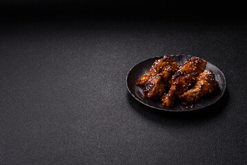 Grilled chicken wings in teriyaki sauce. Hot spicy takeaway food
