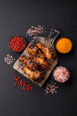 Grilled chicken wings in teriyaki sauce. Hot spicy takeaway food