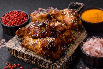 Grilled chicken wings in teriyaki sauce. Hot spicy takeaway food