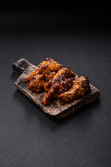 Grilled chicken wings in teriyaki sauce. Hot spicy takeaway food