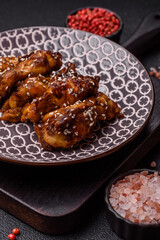 Grilled chicken wings in teriyaki sauce. Hot spicy takeaway food