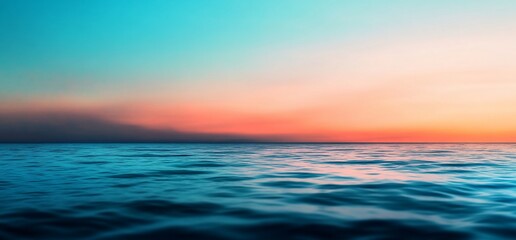 Obraz premium Spectacular view of the ocean with a gradient sunset reflecting on the water