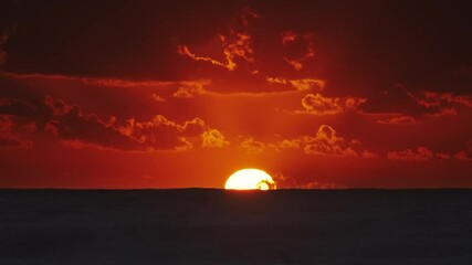Vibrant sunset over ocean with dramatic clouds at dusk, timelapse 4k - Powered by Adobe