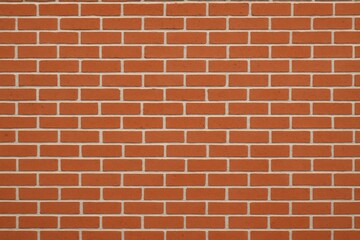 Obraz premium High-resolution photo of a red brick wall with mortar lines and a traditional running bond pattern. This classic architectural texture is ideal for backgrounds, construction themes, design mockups